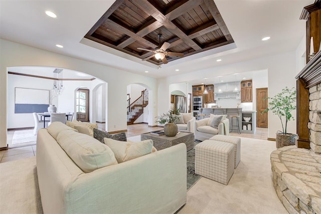 5905 Smoky Hill Trl, Edmond, OK 73034 - living area featuring arched walkways, wooden ceiling with exposed beams, recessed lighting, coffered ceiling, and a ceiling fan