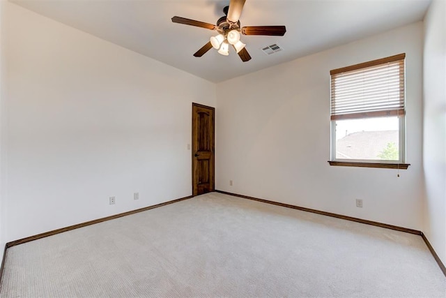 5905 Smoky Hill Trl, Edmond, OK 73034 - empty room featuring light carpet, baseboards, and a ceiling fan