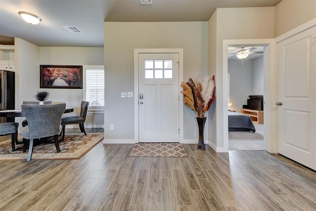 11734 Split Oak Cir, Guthrie, OK 73044 - foyer featuring wood finished floors, ceiling fan, and baseboards