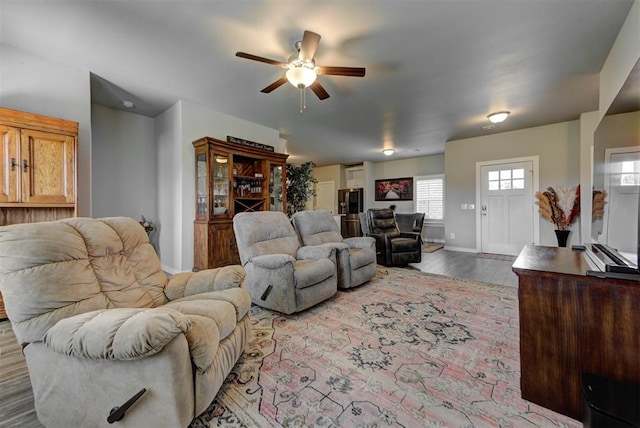 11734 Split Oak Cir, Guthrie, OK 73044 - living room featuring a ceiling fan, wood finished floors, and baseboards