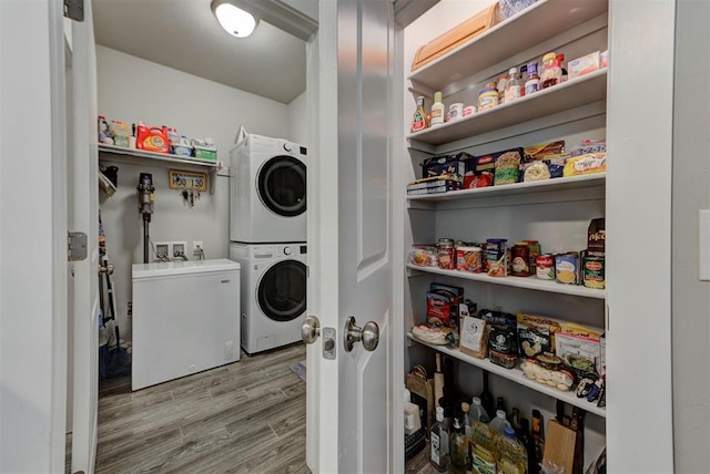 11734 Split Oak Cir, Guthrie, OK 73044 - washroom with stacked washer / drying machine and wood finished floors