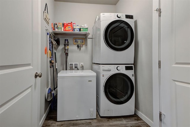 11734 Split Oak Cir, Guthrie, OK 73044 - laundry area with stacked washer / drying machine, wood finished floors, and baseboards