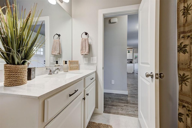 11734 Split Oak Cir, Guthrie, OK 73044 - bathroom with vanity, wood finished floors, and baseboards