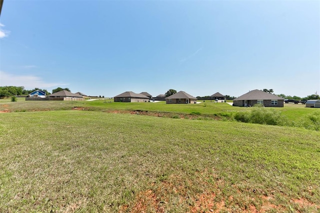 11734 Split Oak Cir, Guthrie, OK 73044 - view of green lawn featuring a residential view