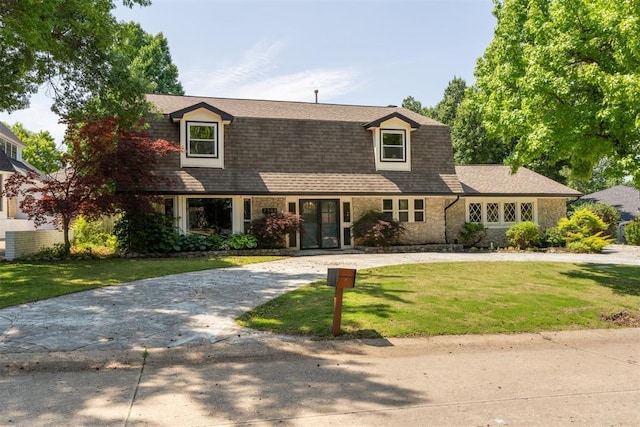 2208 Amber Rd, Oklahoma City, OK 73170 - dutch colonial with curved driveway, a front lawn, and stone siding