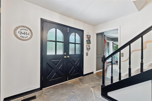 2208 Amber Rd, Oklahoma City, OK 73170 - foyer featuring baseboards and stairway