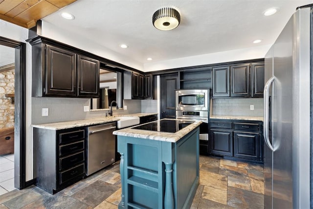 2208 Amber Rd, Oklahoma City, OK 73170 - kitchen with stainless steel appliances, a sink, open shelves, a center island, and recessed lighting