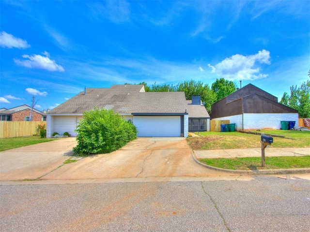 5902 Fox Run Way, Oklahoma City, OK 73142 - view of front of property featuring concrete driveway and a garage