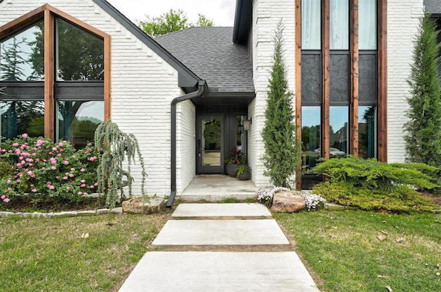 4420 Trophy Dr, Norman, OK 73072 - entrance to property featuring brick siding, a yard, and roof with shingles