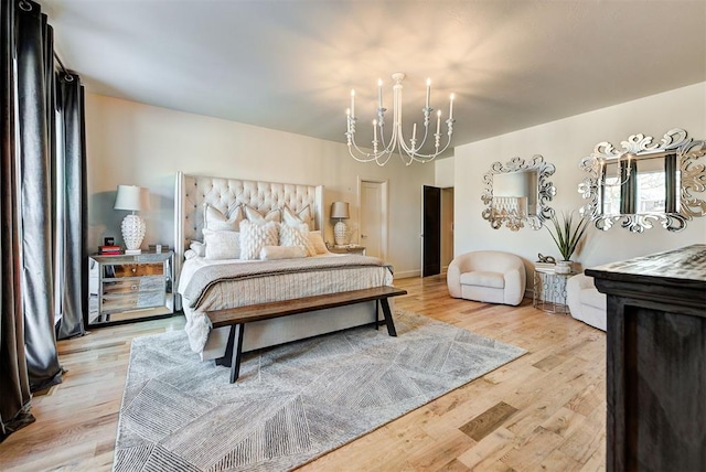4420 Trophy Dr, Norman, OK 73072 - bedroom with a chandelier and light wood-style flooring