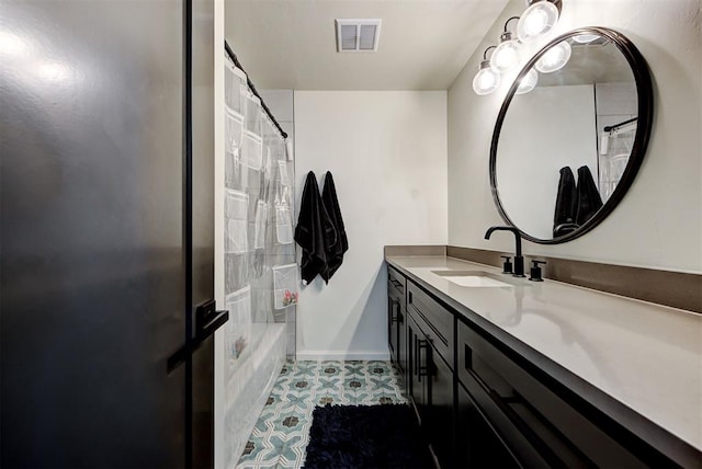 4420 Trophy Dr, Norman, OK 73072 - bathroom featuring vanity, shower / tub combo, tile patterned floors, and baseboards