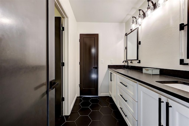 4420 Trophy Dr, Norman, OK 73072 - bathroom featuring double vanity, tile patterned flooring, and baseboards
