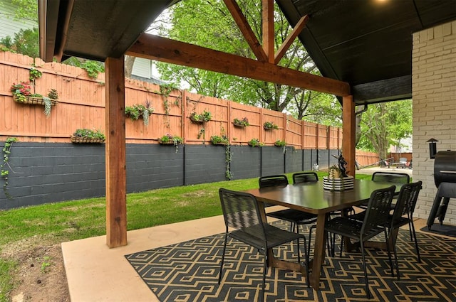 4420 Trophy Dr, Norman, OK 73072 - fenced backyard featuring a patio and outdoor dining area