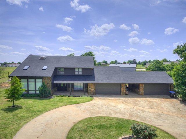 19005 Aerial Rd, Edmond, OK 73012 - mid-century home featuring an attached garage, curved driveway, stone siding, a front yard, and roof with shingles