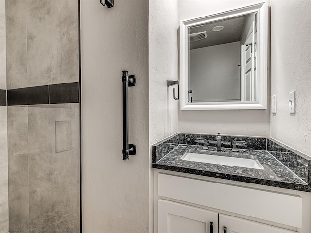 19005 Aerial Rd, Edmond, OK 73012 - bathroom featuring a textured wall and vanity