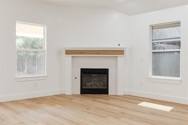 2016 NW 172nd St, Edmond, OK 73012 - unfurnished living room featuring a fireplace, wood finished floors, baseboards, and vaulted ceiling