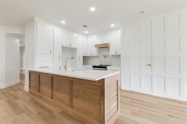 2016 NW 172nd St, Edmond, OK 73012 - kitchen featuring a sink, light wood-type flooring, light countertops, stainless steel range with electric cooktop, and recessed lighting