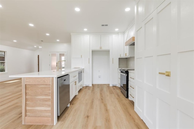 2016 NW 172nd St, Edmond, OK 73012 - kitchen featuring black / electric stove, dishwasher, light wood finished floors, a sink, and recessed lighting