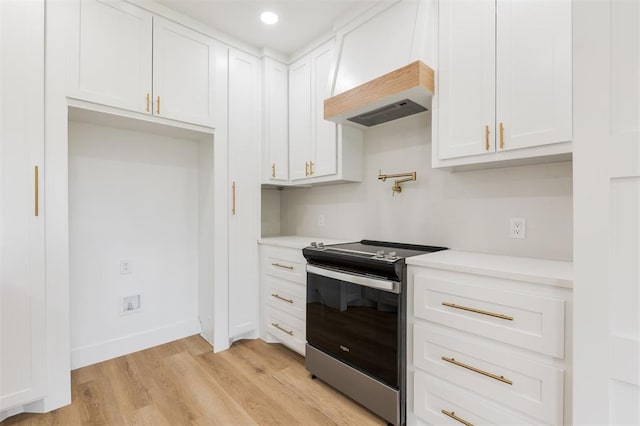 2016 NW 172nd St, Edmond, OK 73012 - kitchen with electric range, light countertops, white cabinetry, and recessed lighting