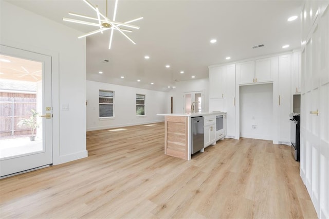 2016 NW 172nd St, Edmond, OK 73012 - kitchen with white cabinetry, dishwasher, recessed lighting, light wood-style floors, and open floor plan
