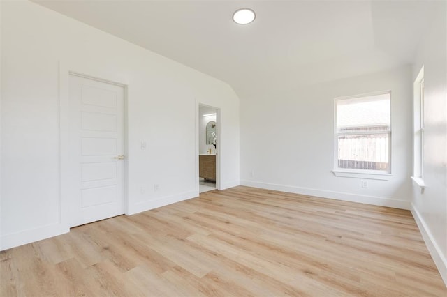 2016 NW 172nd St, Edmond, OK 73012 - unfurnished room featuring light wood-style floors, baseboards, and lofted ceiling