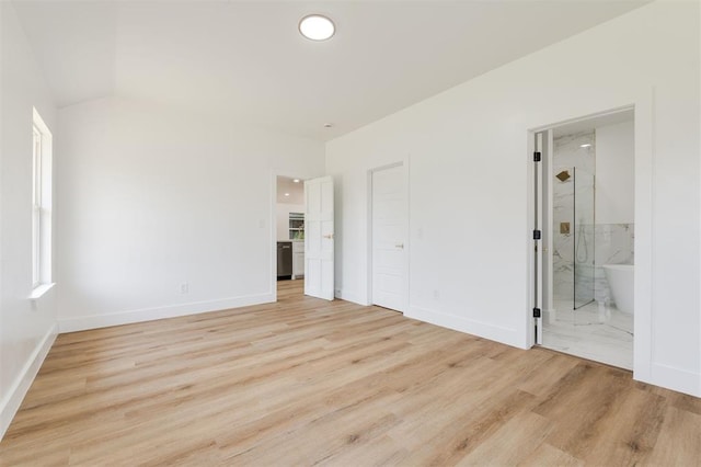 2016 NW 172nd St, Edmond, OK 73012 - unfurnished bedroom featuring light wood finished floors, baseboards, and ensuite bathroom