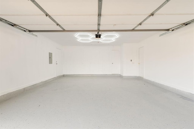 2016 NW 172nd St, Edmond, OK 73012 - garage with a garage door opener, electric panel, and baseboards