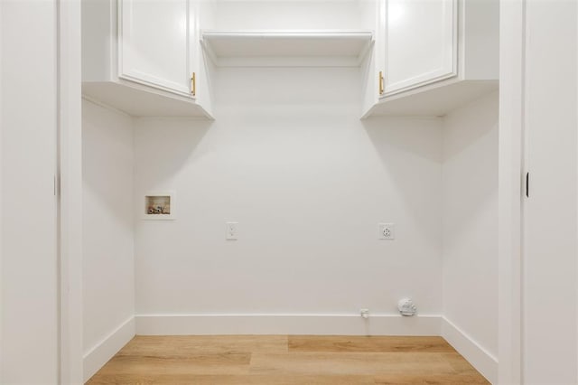 2016 NW 172nd St, Edmond, OK 73012 - washroom with cabinet space, hookup for a washing machine, electric dryer hookup, and wood finished floors