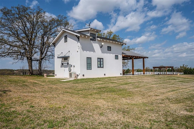 18800 NE 122nd St, Jones, OK 73049 - view of side of property with a gazebo, a lawn, and stucco siding