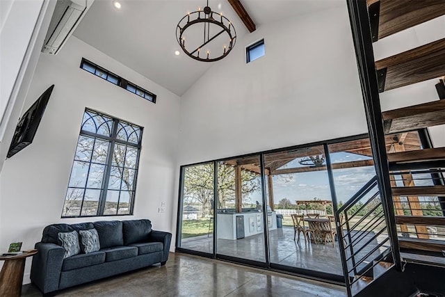 18800 NE 122nd St, Jones, OK 73049 - living room with finished concrete floors, high vaulted ceiling, a chandelier, beam ceiling, and stairway