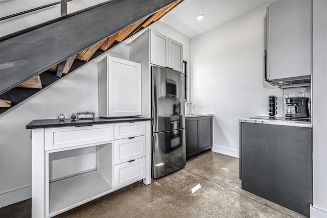 18800 NE 122nd St, Jones, OK 73049 - kitchen featuring freestanding refrigerator, finished concrete floors, baseboards, white cabinets, and recessed lighting