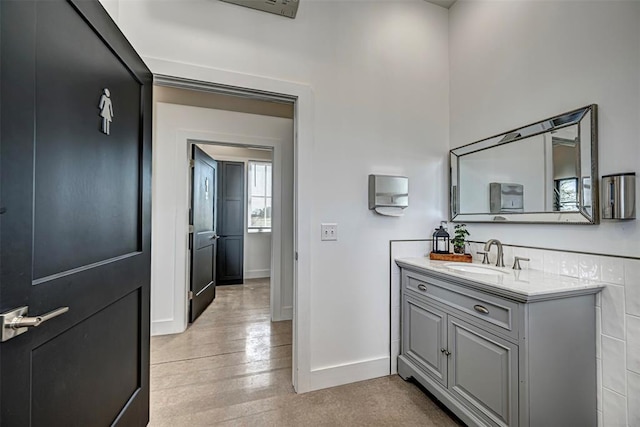18800 NE 122nd St, Jones, OK 73049 - bathroom with vanity, baseboards, and wood finished floors