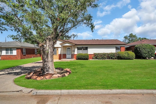 1036 Box St, Altus, OK 73521 - single story home featuring brick siding, a front lawn, and driveway