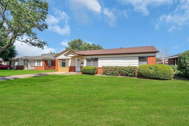 1036 Box St, Altus, OK 73521 - ranch-style house featuring brick siding and a front lawn