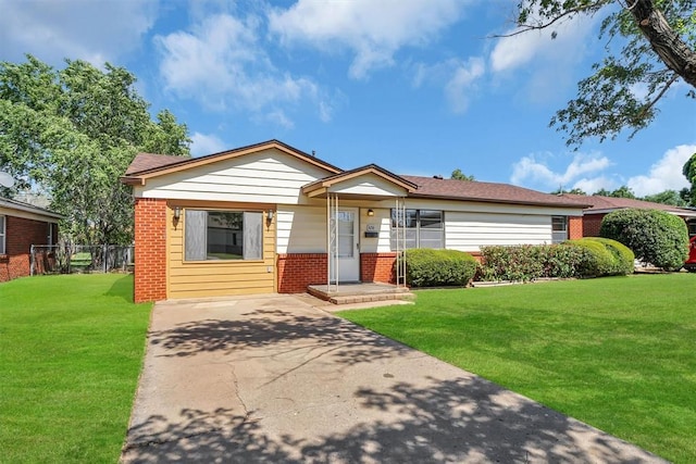 1036 Box St, Altus, OK 73521 - view of front of home with brick siding and concrete driveway