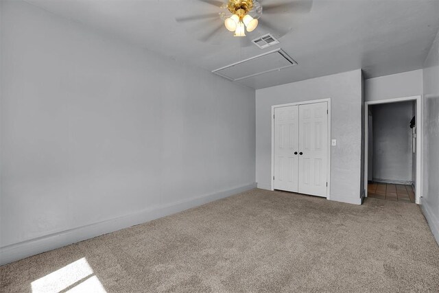 1036 Box St, Altus, OK 73521 - unfurnished bedroom featuring attic access, carpet, a closet, baseboards, and a ceiling fan