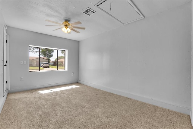 1036 Box St, Altus, OK 73521 - unfurnished room featuring attic access, carpet, ceiling fan, and baseboards