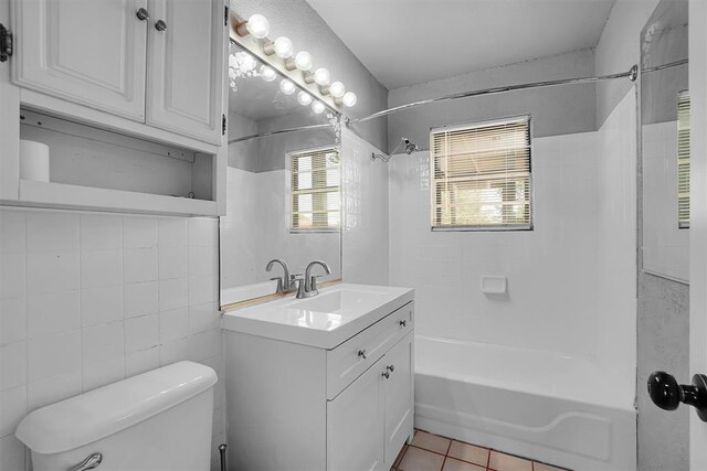 1036 Box St, Altus, OK 73521 - full bath with shower / washtub combination, vanity, tile patterned floors, and toilet