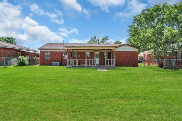 1036 Box St, Altus, OK 73521 - rear view of property featuring brick siding and central air condition unit