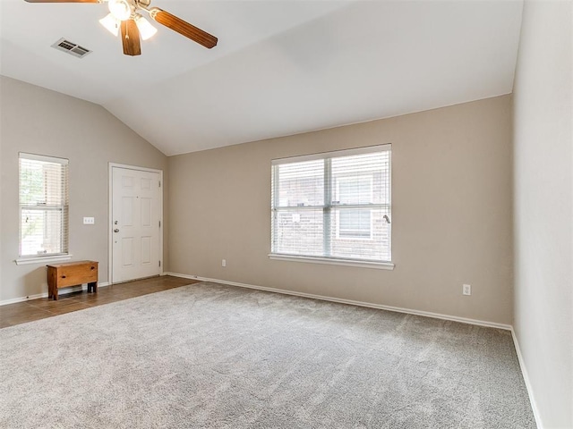 19901 Adagio Ln, Edmond, OK 73012 - carpeted spare room featuring baseboards, lofted ceiling, and ceiling fan