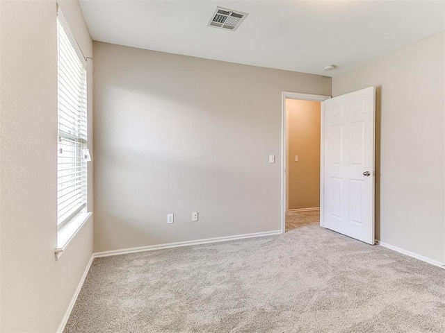 19901 Adagio Ln, Edmond, OK 73012 - carpeted spare room featuring baseboards and a smoke detector