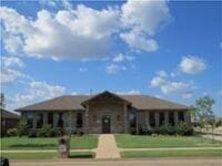 19901 Adagio Ln, Edmond, OK 73012 - ranch-style home featuring a front lawn