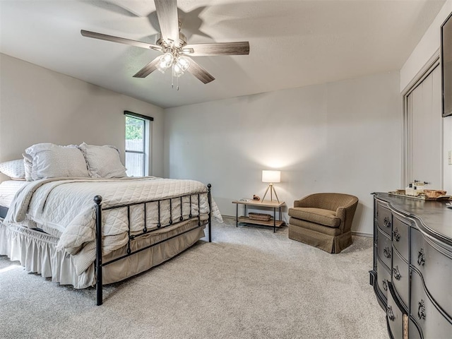 13613 Pin Oak, Edmond, OK 73013 - bedroom with light carpet and a ceiling fan