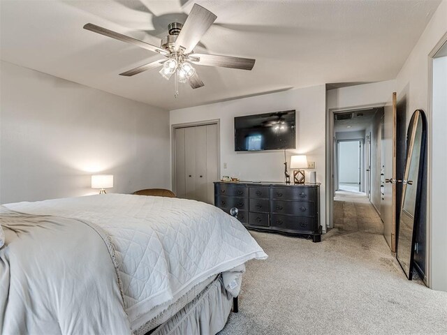 13613 Pin Oak, Edmond, OK 73013 - bedroom featuring carpet, ceiling fan, and a closet