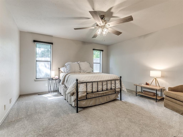 13613 Pin Oak, Edmond, OK 73013 - bedroom with carpet, ceiling fan, and baseboards