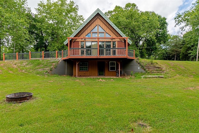 1000 N Canadian Ave, Purcell, OK 73080 - rear view of property with a fire pit, a yard, and a deck