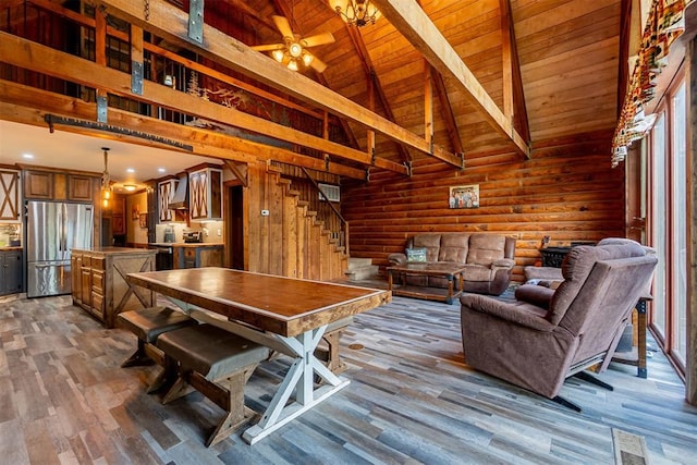 1000 N Canadian Ave, Purcell, OK 73080 - dining space featuring wood finished floors, wooden ceiling with exposed beams, stairs, a ceiling fan, and high vaulted ceiling