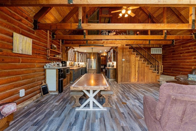 1000 N Canadian Ave, Purcell, OK 73080 - dining area with wood ceiling with exposed beams, high vaulted ceiling, dark wood finished floors, log walls, and stairway