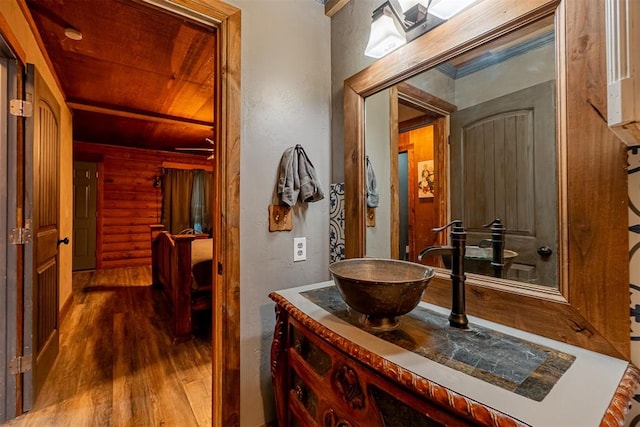 1000 N Canadian Ave, Purcell, OK 73080 - bathroom with wood finished floors and vanity