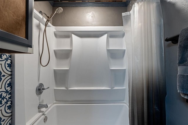 1000 N Canadian Ave, Purcell, OK 73080 - bathroom featuring shower / bath combo with shower curtain and a textured wall